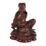 A Chinese stained boxwood figure of Guanyin