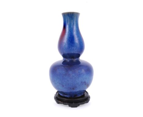 A good Chinese Flambé double-gourd vase, Qing Dynasty, late 18th or early 19th century, the stoutly-potted body supported on 