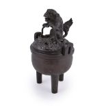 A Chinese bronze tripod censer and cover