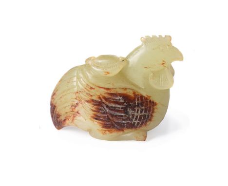 A good Chinese yellow jade and russet carving of a crouching chicken, 19th century, Qing Dynasty, the bird carved holding a l
