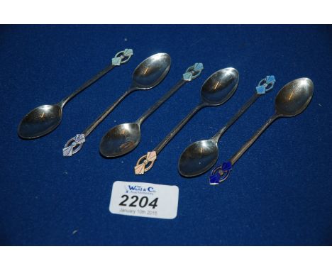 A set of six Silver and enamel Coffee Spoons