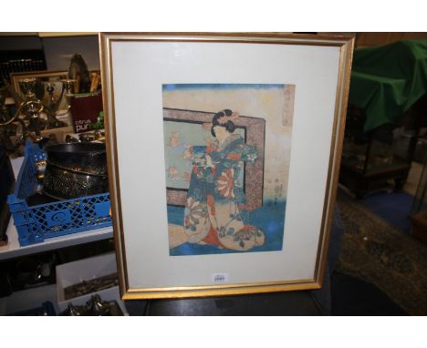 A Japanese framed and mounted woodblock Print of a Japanese Lady by Kuniyoshi.  10'' x 14'' 