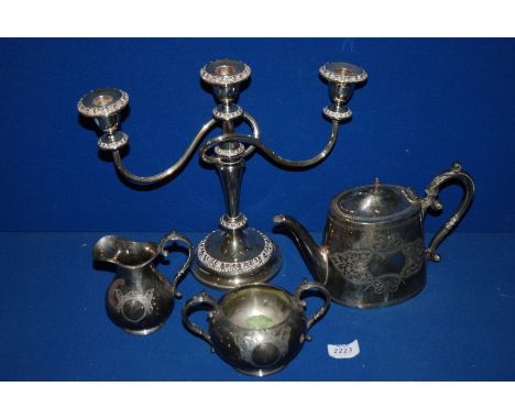 A quantity of plated items including a candelabra, teapot, Sucrier and milk jug