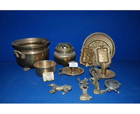 A quantity of brass including stags head Door Knockers, a Chamber Stick, Jardiniere, Ashtrays etc.