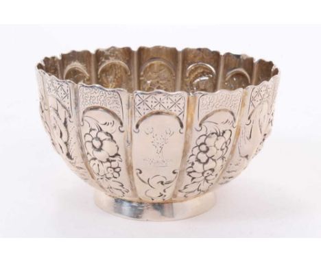 Victorian silver bowl of circular form with panels of chased decoration depicting squirrels, birds, snakes and flowers, raise