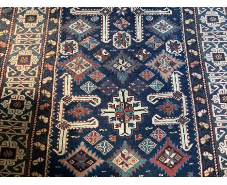 A Kasak runner, with angular ornament in multiple borders, 115 x 260cmGood condition, some wear to fringes