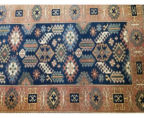 Kasak style runner, with repeat flower head motif in conforming main border, 87cm x 340cm