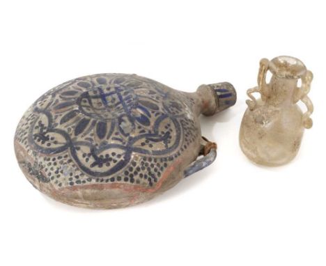 Roman twin-handled glass vase with some iridescence, and a pottery saddle flask with blue painted geometric patterns (2)