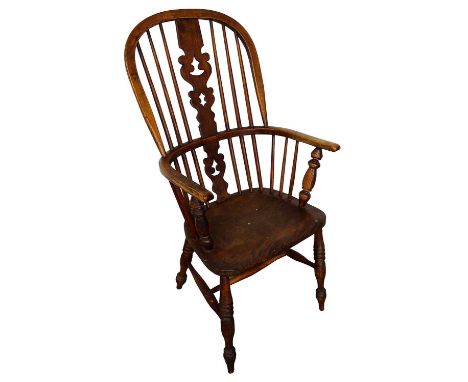 19th century Windsor armchair with high shaped stick back with pierced vase shaped splat, on saddle seat on turned splayed su