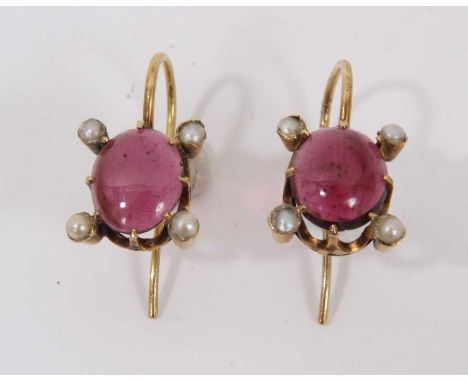 Pair of antique cabochon garnet and seed pearl earrings with an oval cabochon and four seed pearls in gold setting, 19mm.