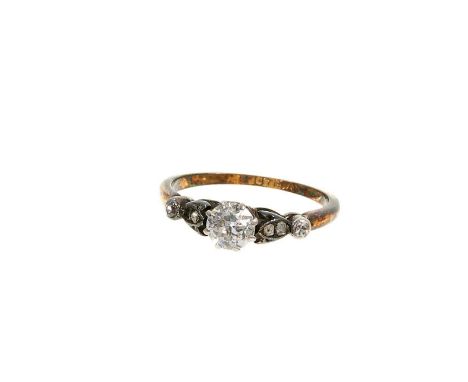 Diamond single stone ring with an old cut diamond weighing approximately 0.40cts in platinum claw setting with rose cut diamo