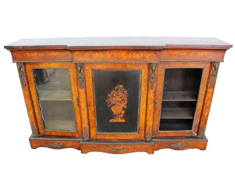 Mid Victorian burr walnut, inlaid and ormolu mounted breakfront cabinet, with concave inlaid frieze and central vase inlaid d