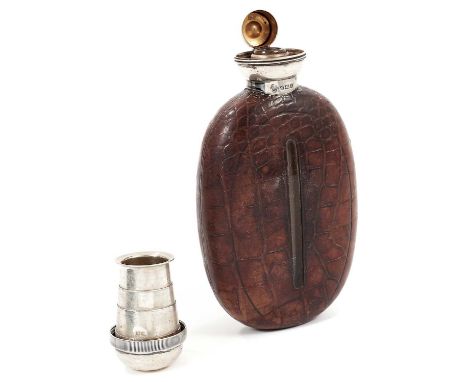 Unusual George V silver topped glass hip flask of oval form mounted in simulated crocodile skin leather, the screw top with c