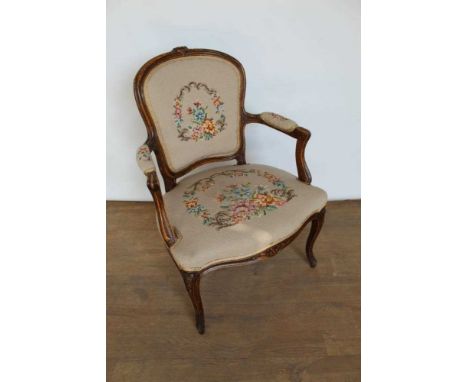 Louis XVI style carved beech tapestry upholstered open armchair, with carved showwood frame on cabriole legs