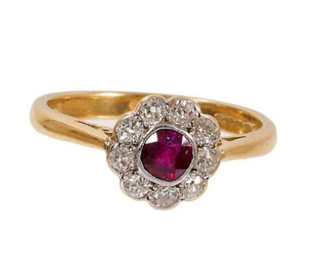 Ruby and diamond cluster ring with original receipt dated 1935, the daisy cluster with a round mixed cut ruby measuring appro