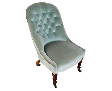 William IV occasional chair, with button upholstery raised on lappet carved legs and castors 