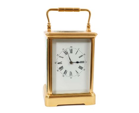 French brass carriage clock with white enamel dial in gilded brass case, 17.5cm high.