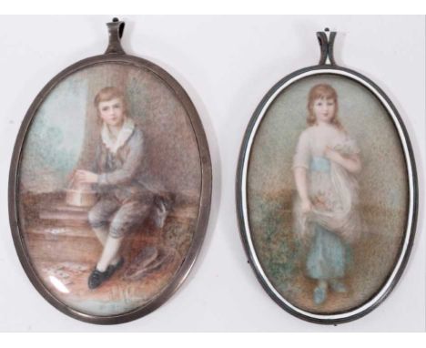 A late 19th / early 20th century portrait miniature of a young man, building a tower of cards, in white metal frame, oval, to