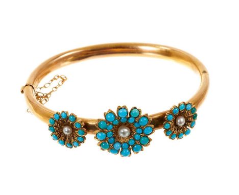Victorian gold and turquoise hinged bangle with three daisy flower head clusters on a gold tubular hinged bangle.The bangle i