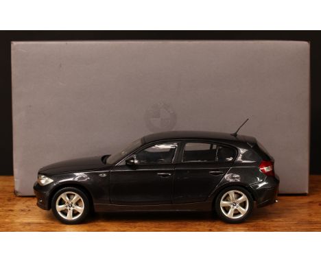 A Kyosho 1:18 scale BMW 1 series collector's model, boxed with original inner polystyrene packaging pieces, probably previous