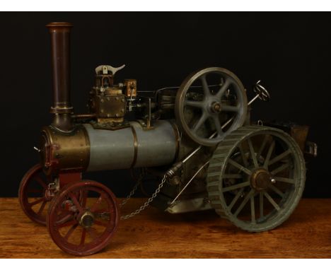 A scratch-built live steam traction engine, unknown maker, flat grey livery, fitted with English style brass straked wheels, 