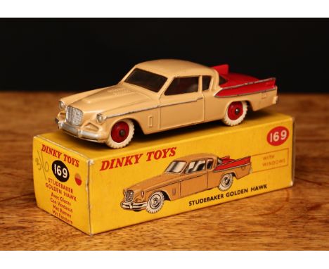 Dinky Toys 169 Studebaker Golden Hawk with windows, tan body with red rear panel and sides, red ridged hubs with white tyres,