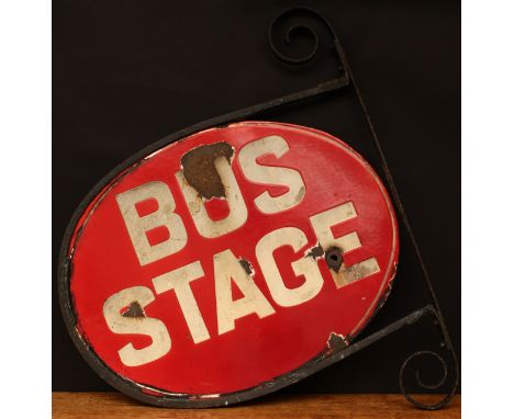 Motoring and Transportation Interest - a shaped oval double sided enamel sign with wrought iron wall bracket, white lettering