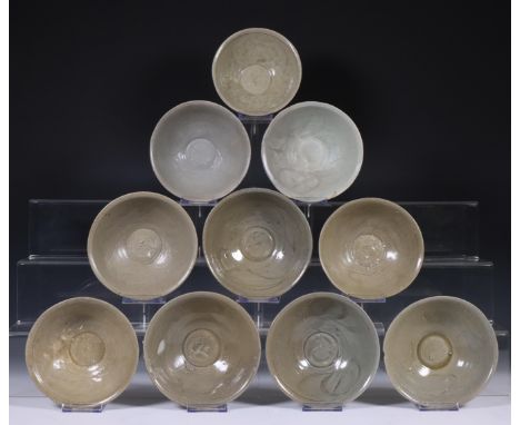 China, ten celadon glazed bowls, Northern Sung dynasty, 10th-12th century, with stylised floral decoration, covered with vary