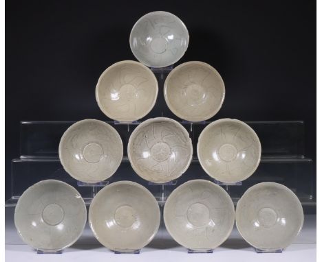 China, ten celadon glazed bowls, Northern Sung dynasty, 10th-12th century, with sculpted rim and stylised floral decoration, 