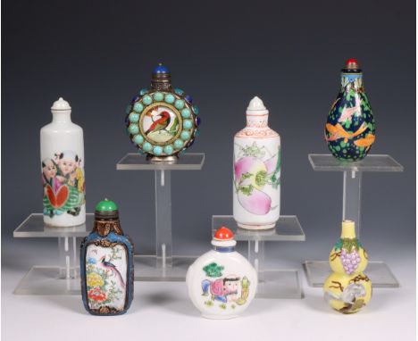 China, collection of porcelain and enamel snuff bottles, comprising four porcelain snuff bottles, two enamel bottles and a me