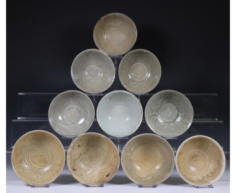 China, ten celadon glazed bowls, Northern Sung dynasty, 10th-12th century, with stylised floral and combed decoration, covere