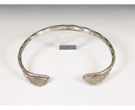 China/ Southeast Asia, Hmong or Miao, silver spang collier the hammered and canted collier terminating in wing-shaped ornamen