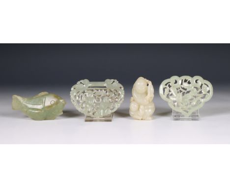 China, four jade carvings, 19th/ 20th century, comprising two openworked pendants, a model of a fish and a 'boys' group l. 8,