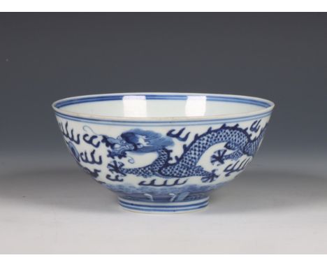 China, blue and white porcelain 'dragon' bowl, Guangxu six-character mark, 19th/ 20th century, painted with two dragons and t