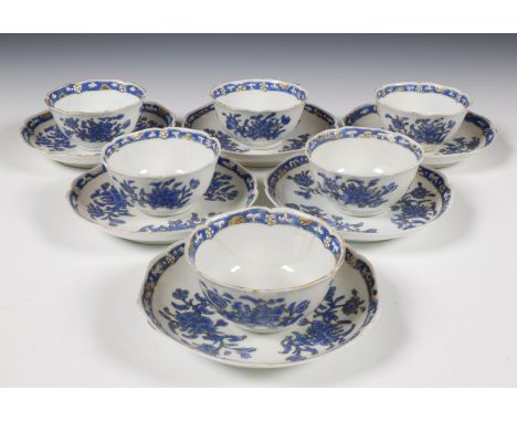 China, set of six blue-enamelled and gilt-decorated cups and saucers, 18th century, each decorated with sprays of peony surro