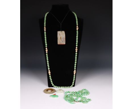 China, jade pendant with a decoration of gourds and a bat, together with another jade and pendant, an agate carved pendantwit