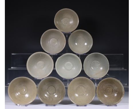 China, ten celadon glazed bowls, Northern Sung dynasty, 10th-12th century, with stylised floral decoration, covered with vary