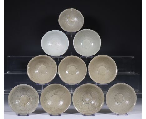 China, ten celadon glazed bowls, Northern Sung dynasty, 10th-12th century, with sculpted rim and stylised floral decoration, 