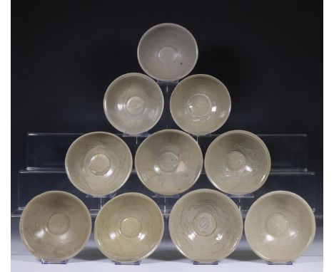 China, ten celadon glazed bowls, Northern Sung dynasty, 10th-12th century, with stylised floral decoration, covered with vary