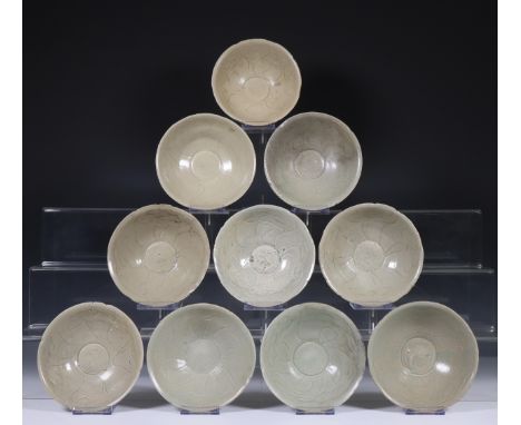 China, ten celadon glazed bowls, Northern Sung dynasty, 10th-12th century, with sculpted rim and stylised floral decoration, 