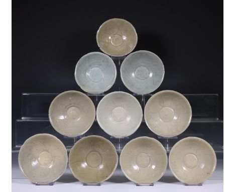 China, ten celadon glazed bowls, Northern Sung dynasty, 10th-12th century, with sculpted rim and stylised floral decoration, 
