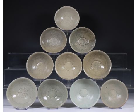 China, ten celadon glazed bowls, Northern Sung dynasty, 10th-12th century, with sculpted rim and stylised floral decoration, 