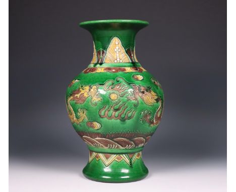 China, sancai-glazed porcelain 'dragon' vase, 20th century, moulded and incised with a pair of dragons chasing the flaming pe