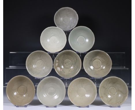 China, ten celadon glazed bowls, Northern Sung dynasty, 10th-12th century, with sculpted rim and stylised floral decoration, 