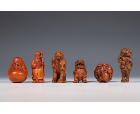 Japan, set of six boxwood netsuke, one as Shoulao, one an oni, one Daruma, one a buddhist lion, one a three-headed wolf and o