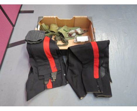 Two Pairs of Cavalry / Infantry Trousers consisting pair of dark blue melton trousers.  Wide red side lines.  Lower boot stra