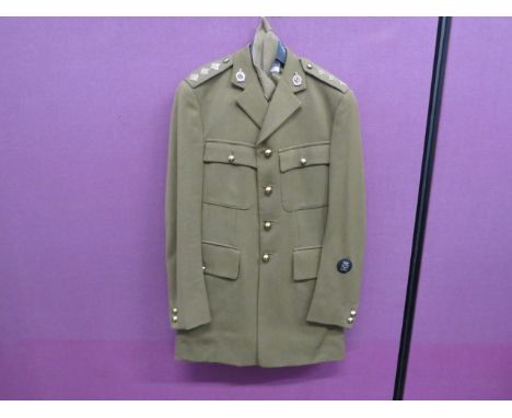 Queens Royal Irish Hussars Officer's Service Dress Uniform consisting khaki, single breasted, open collar tunic.  Patch chest