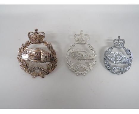 Three Royal Tank Regiment Piper Badges consisting QC silvered large scale badge.  Two rear extended lugs ... Similar smaller 