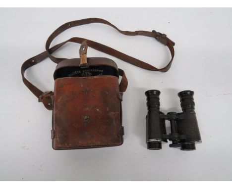 Pair of WW1 Officer's Binoculars Paris made field binoculars.  Leather covered body.  Blackened frame and lenses.  Broad arro