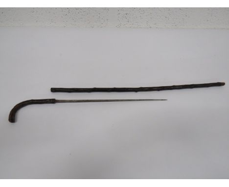 19th Century Sword Stick 17 1/2 inch single edged blade with narrow fuller. Bentwood handle with steel ferrule. Contained in 